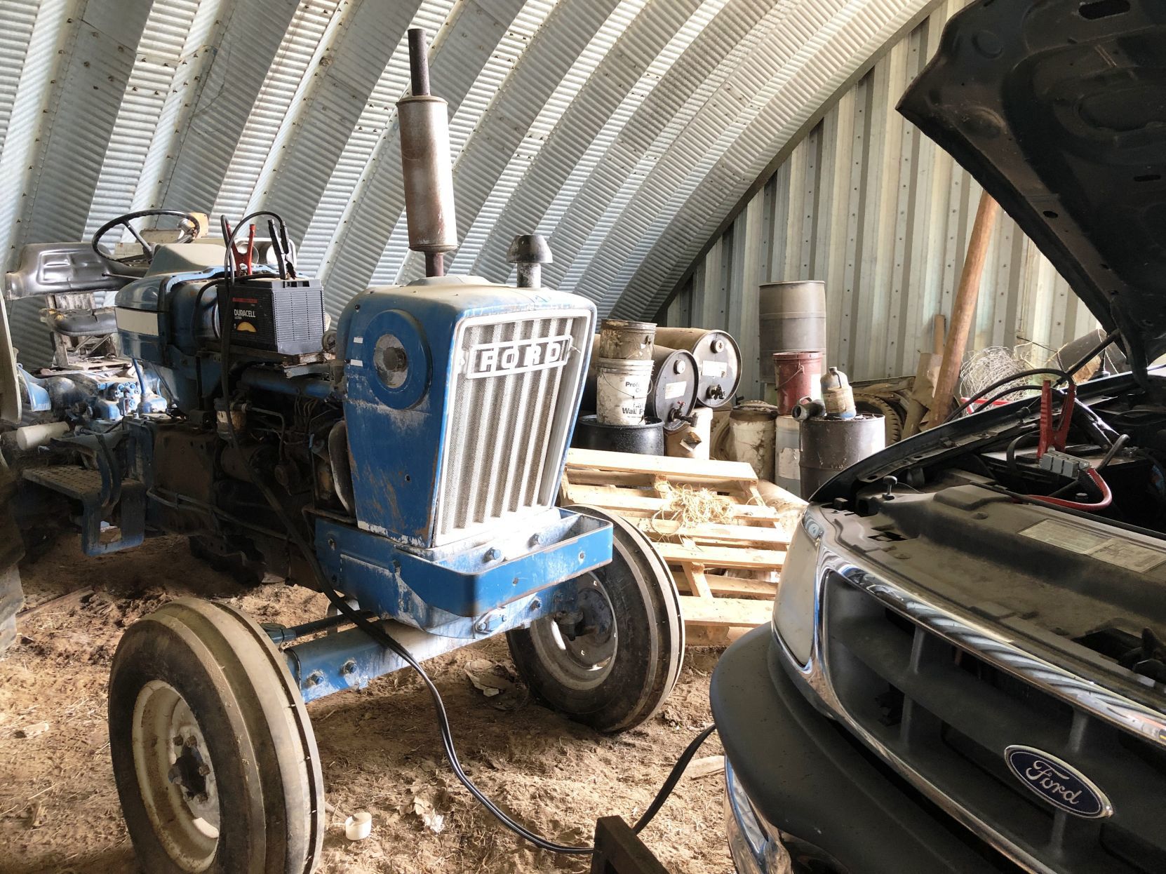 A dead battery on the Hardie tractor needs to be jump-started.